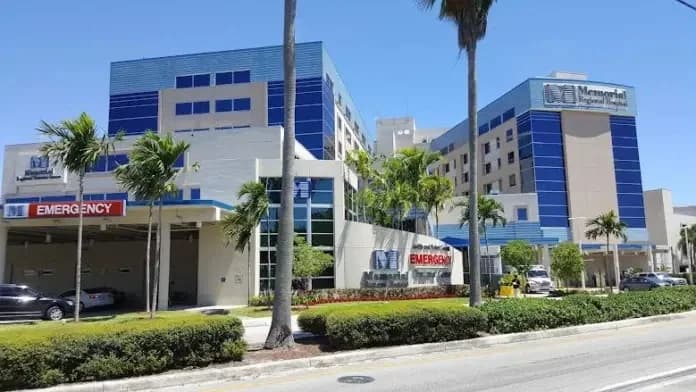 Hospital exterior with an emergency entrance and Memorial Regional Hospital signage