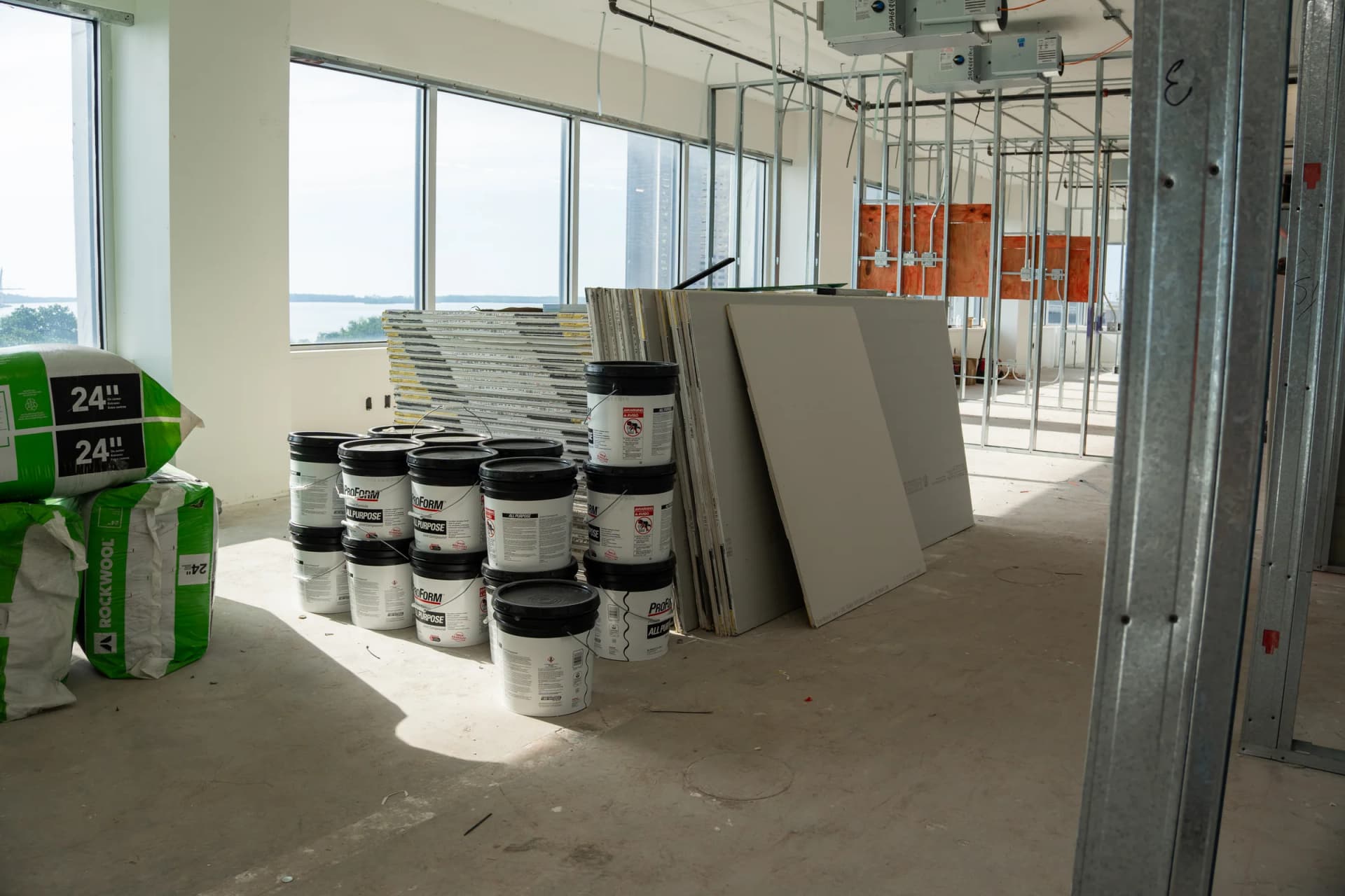 Drywall materials staged inside 100 Biscayne