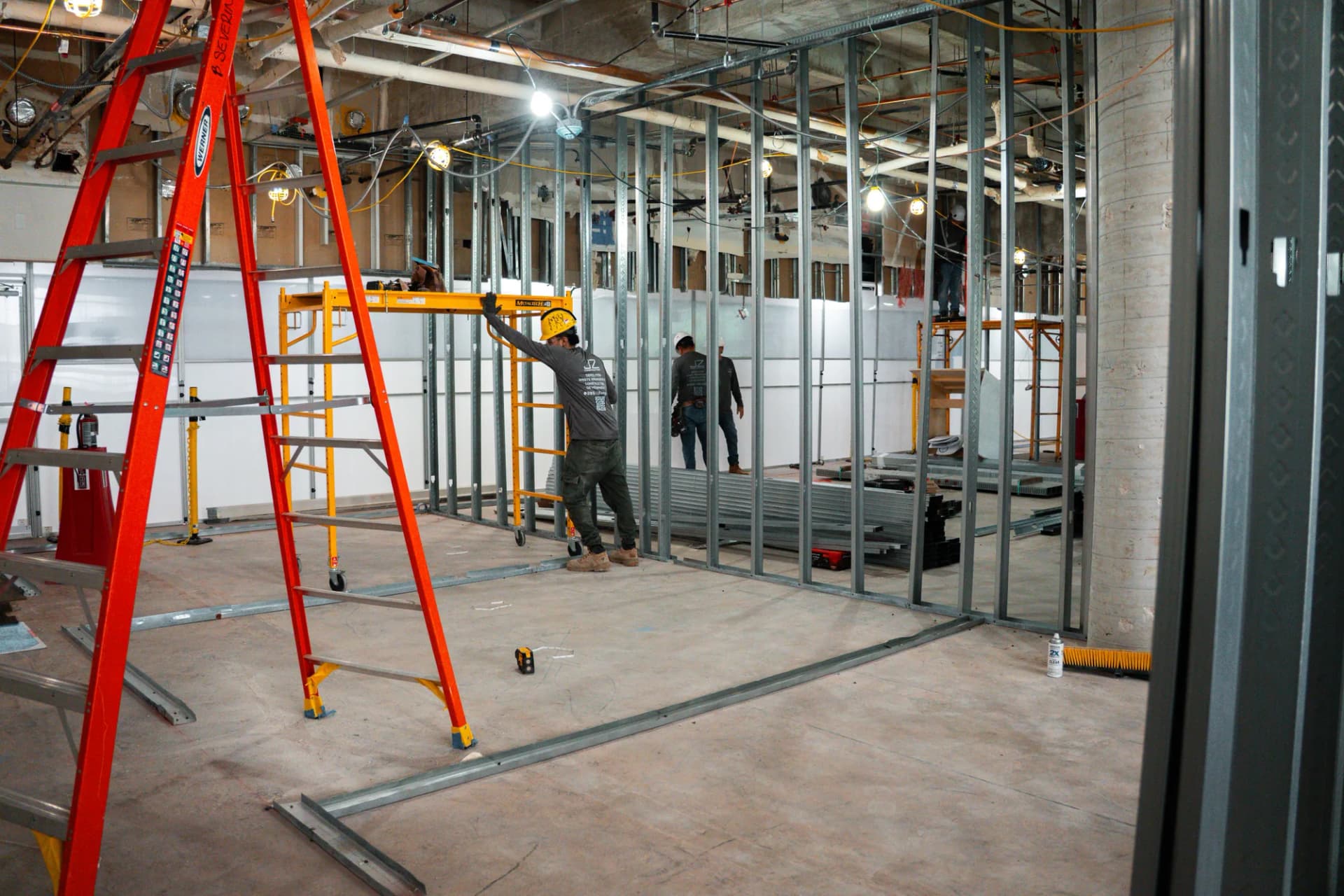 JZ crew coordinating interior framing and scaffolds at Bascom Palmer